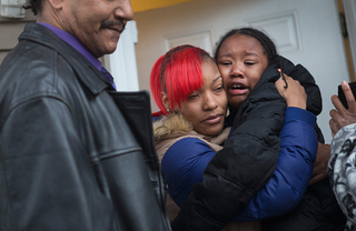LaTonya Jones, center, the daughter of Bettie Jones, outside her home on Dec. 27, 2015, in Chicago. (Scott Olson/Getty Images)
